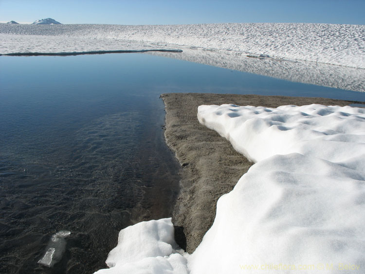 A view of snow and ice covered Las Animas Lake on the Mondaca Trail from Radal Siete Tazas, Chile.