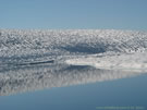 A view of snow and ice-covered Las Animas Lake on the Mondaca Trail from Radal Siete Tazas, Chile.