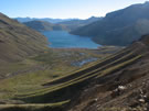 Image of mountain slope and Laguna Maule.