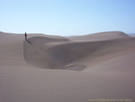 An image of Putu dunes with a person standing on one side.