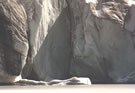 An image of an ice wall on a small glacier lake at El Morado National Park.