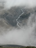 Free Flying:  An  image of a river flowing, viewed from above through the clouds, Mondaca Trail, Radal Siete Tasas National Park, Chile.