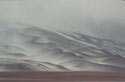 Dissolution  :  An image of slopes covered by snow which dissolve in the white, foggy sky.