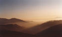 The City of Santiago�:  An image of Santiago covered by smog, as seen from Farellones.