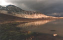 False Romanticism:  An image of San Franscisco Lake at La Parva (close to False La Parva peak) with clouds.